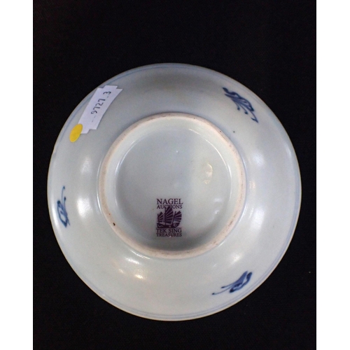 232 - A CHINESE 'TEK SING CARGO' BLUE AND WHITE PORCELAIN SAUCER

decorated with flowers, 10.5cm diameter,... 