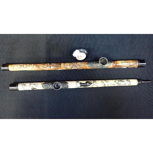 245 - TWO CHINESE OPIUM PIPES

with a Far Eastern knob