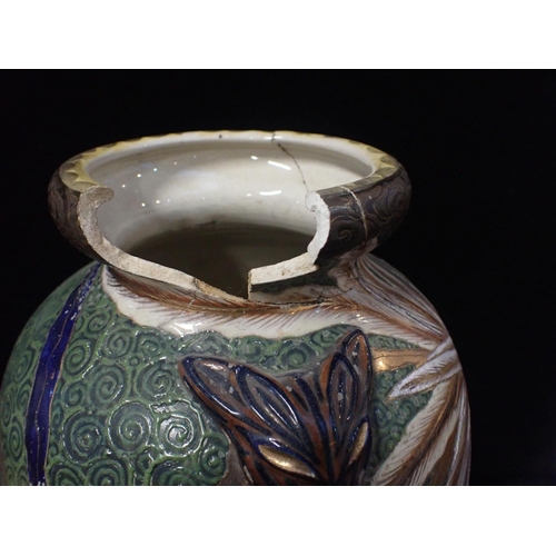 246 - AN EARLY 20TH CENTURY JAPANESE SATSUMA POTTERY VASE

decorated with peacocks on a textured green gro... 