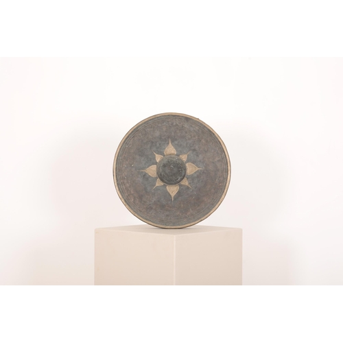 248 - A BURMESE BRONZE GONG

late 19th/early 20th Century, with central boss, gilded star design and gilde... 