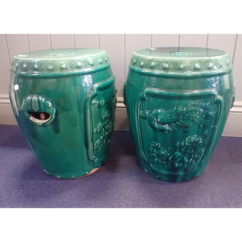 250 - A PAIR OF CHINESE GREEN GLAZED GARDEN SEATS

of drum form 41cm high