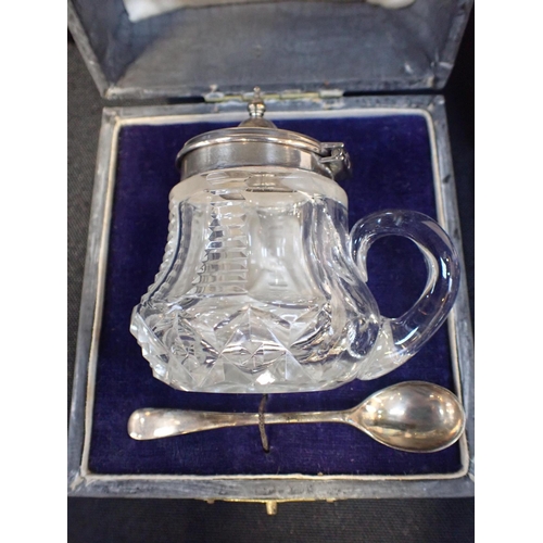 299 - A SILVER TOPPED MUSTARD POT AND SPOON

a silver handled knife and a set of silver coffee bean teaspo... 