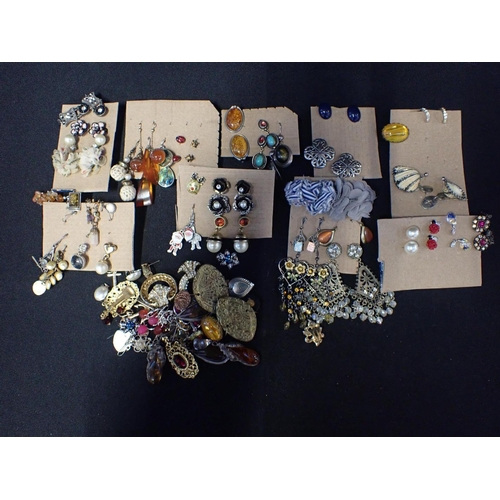 329 - A QUANTITY OF COSTUME JEWELLERY

mostly earrings, including reconstituted amber