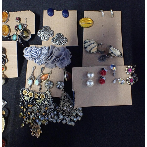 329 - A QUANTITY OF COSTUME JEWELLERY

mostly earrings, including reconstituted amber