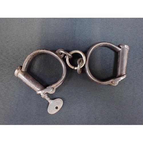 339 - A PAIR OF VICTORIAN HIATT HANDCUFFS

No.7, with key,  stamped 'HARD'