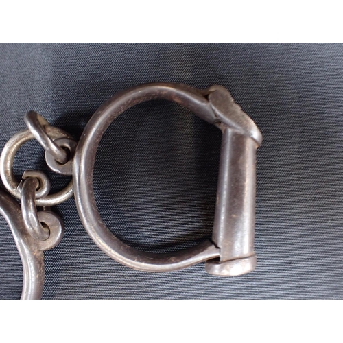 339 - A PAIR OF VICTORIAN HIATT HANDCUFFS

No.7, with key,  stamped 'HARD'