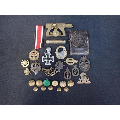 383 - A COLLECTION OF MILITARY BADGES

cap badges, some German (some a/f), and a T. Cook and Simmon sight