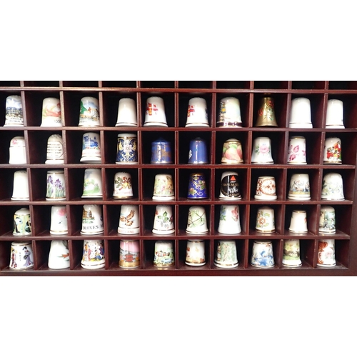 49 - COLLECTION OF THIMBLES

mostly ceramic, in display case