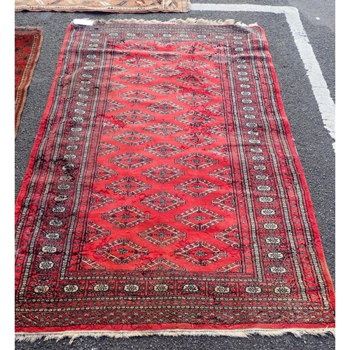 528 - A BELUCH RUG OF KAZAK STYLE

woven in muted colours and off white with three octagonal guls and othe... 