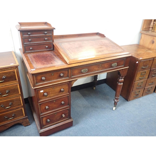 540 - A VICTORIAN MAHOGANY 'DICKENS' TYPE DESK

of unusual single pedestal form, with turned legs to the r... 