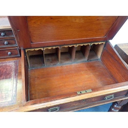 540 - A VICTORIAN MAHOGANY 'DICKENS' TYPE DESK

of unusual single pedestal form, with turned legs to the r... 