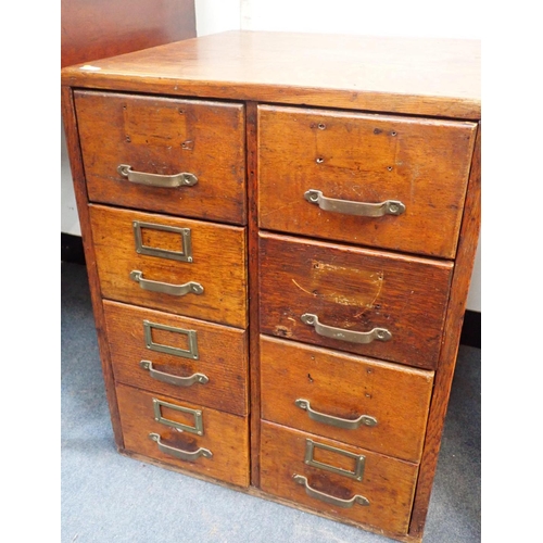 543 - A 1930s OAK EIGHT-DRAWER FILING CHEST

65cm high, 52cm wide, 54cm deep (label holders removed)