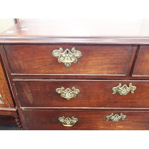 549 - A GEORGE III MAHOGANY CHEST OF DRAWERS

three long and two short, the brass handles with pierced bac... 