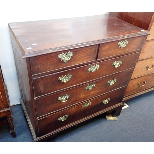 549 - A GEORGE III MAHOGANY CHEST OF DRAWERS

three long and two short, the brass handles with pierced bac... 