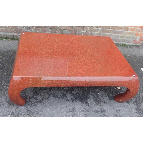 561 - A CHINESE STYLE RED LACQUER LOW TABLE

90 x 130cm (max, at leg) (some cracks)