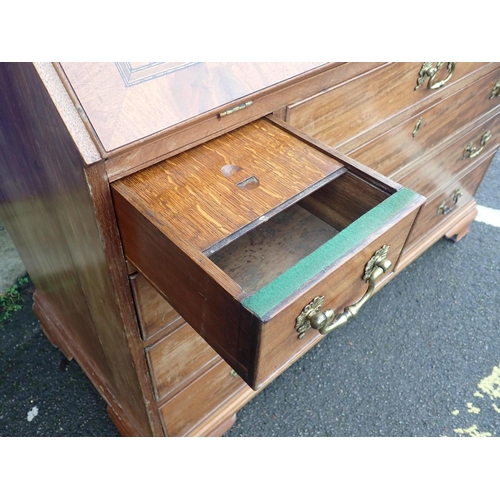 573 - A GEORGE III MAHOGANY BUREAU WITH HOLLY VENEERED AND PENWORK DECORATED ARCADE

to the interior, with... 