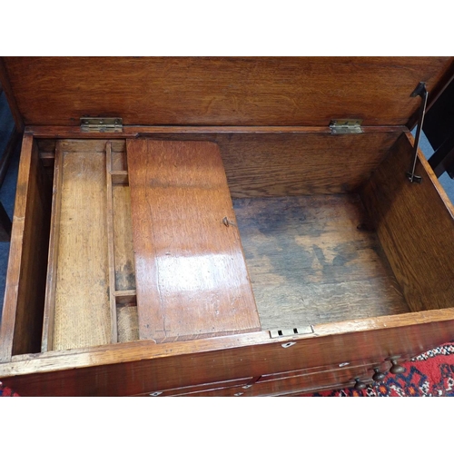 577 - A 19th CENTURY OAK CARPENTER'S CHEST

fitted four graduated drawers with hinged lid and sliding inte... 