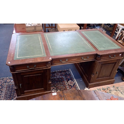 579 - A GEORGE III STYLE MAHOGANY PARTNERS DESK

(reproduction) with arrangement of drawers and cupboards,... 