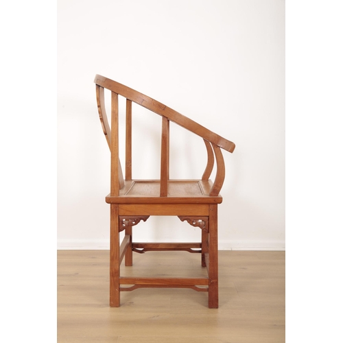 580 - A CHINESE HARDWOOD HORSESHOE ARMCHAIR

20th century or later, with pierced bracket decoration to cor... 