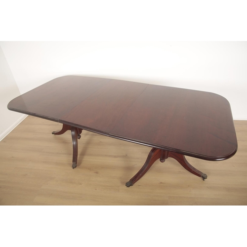 584 - A MAHOGANY TWIN PEDESTAL DINING TABLE

the top with moulded edge and fitted one extra leaf, on splay... 