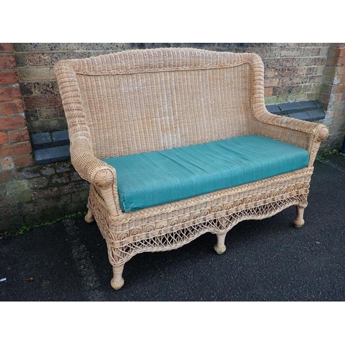 600 - A VICTORIAN STYLE WICKER TWO SEATER SOFA

133cm wide