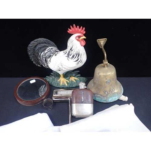 66 - A COLLECTION OF SUNDRIES

including a hip flask, damask tablecloths, a bell, cockerel doorstop etc