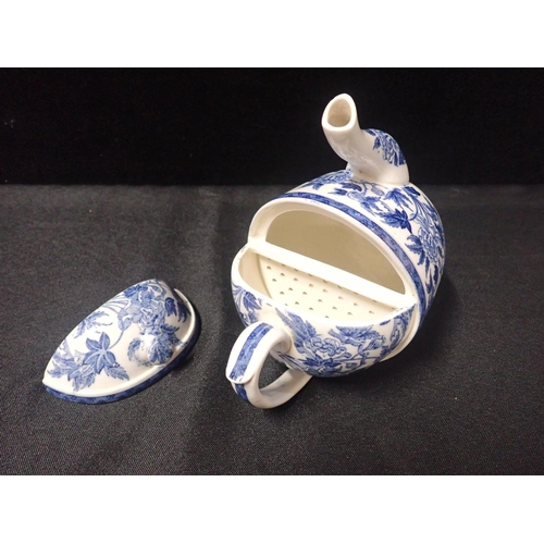 77 - A WEDGWOOD 'S.Y.P.' BLUE AND WHITE POTTERY TEAPOT

peony pattern, designed by Douglas Baillie, 17cm ... 