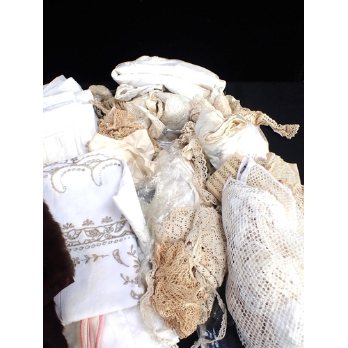 90 - A QUANTITY OF OLD LINENS

lengths of lace trimmings, a fur stole, a 1920s parasol, gloves etc