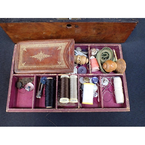 91 - A 19th CENTURY WALNUT WORKBOX

with parquetry top 'WORKBOX', and some contents, including a leather ... 