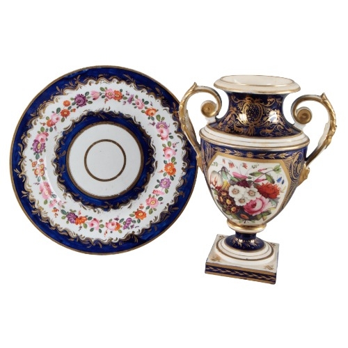 13 - A COALPORT PART TEA SERVICE

early 19th century, decorated with floral garlands, within blue and gil... 