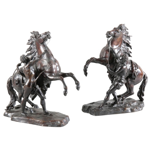 151 - AFTER GUILLAUME I COUSTOU (1677-1746) A pair of bronze marly horses

on naturalistic plinth bases, 4... 