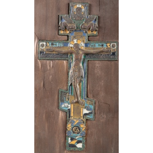 161 - A RUSSIAN BRASS AND ENAMEL ICON

19th century, figured with Christ crucified and angels above, with ... 