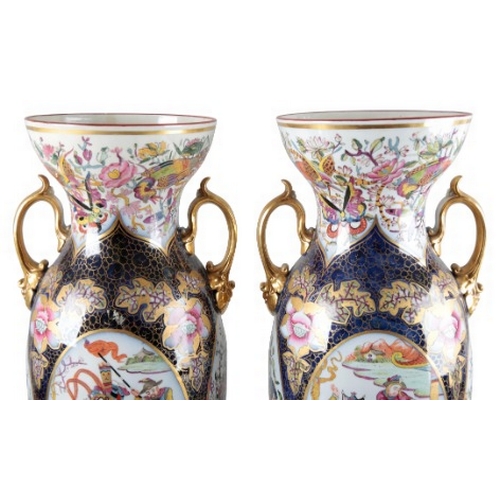 2 - A PAIR OF CONTINENTAL PORCELAIN BALUSTER VASES

19th century, with flared neck and gilt handles, dec... 