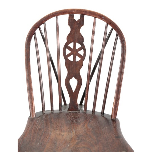 226 - AN ELM AND ASH WINDSOR CHAIR

18th/19th century, with a 'wheel' back over a shaped seat, on splayed ... 