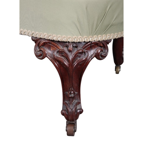 227 - A VICTORIAN WALNUT FOOT STOOL

the serpentine top on foliate carved cabriole legs terminating in bra... 