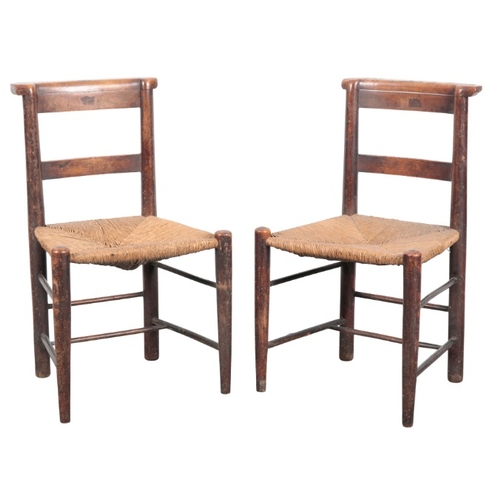 230 - A SET OF SEVEN BEECH SIDE CHAIRS

19th century, with square back splats over rush seats, on turned l... 