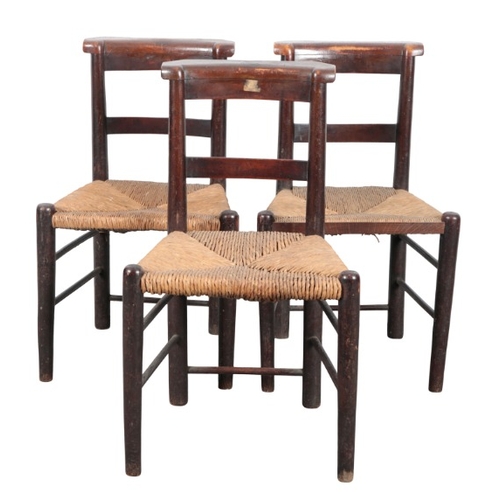 233 - A SET OF TEN BEECH SIDE CHAIRS

19th century, with square back splats over rush seats, on turned leg... 