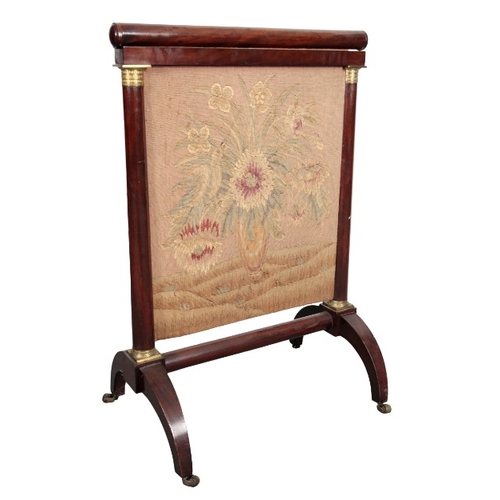 234 - A FRENCH EMPIRE MAHOGANY FIRESCREEN

inset with a needlework panel depicting a bird in a vase of flo... 