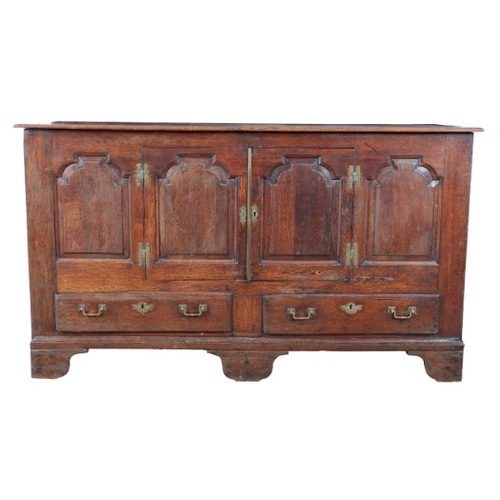 243 - AN ENGLISH OAK SIDEBOARD

18th century and later, with cupboard doors set into the panelled front, t... 