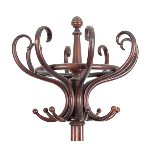 247 - AN EDWARDIAN BENTWOOD COAT AND HAT STAND

with eight scrolled branches, on a quadruped base, 200cm h... 