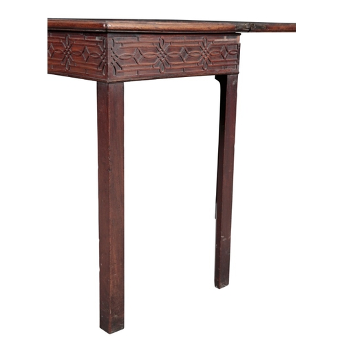 248 - A GEORGE III MAHOGANY TEA TABLE

the hinged lid over a relief carved frieze, on block legs, 73cm hig... 