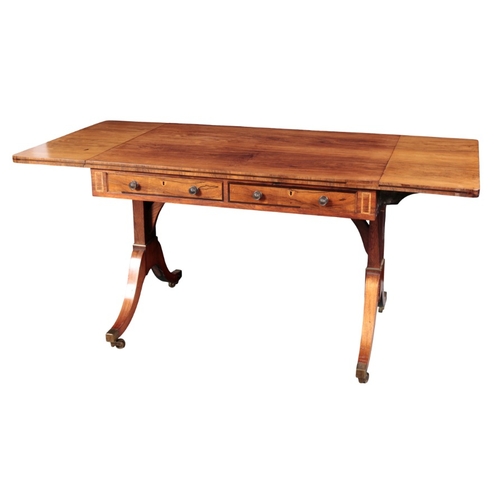 257 - A GEORGE IV ROSEWOOD SOFA TABLE

the rectangular top over two frieze drawers to one side and two fau... 