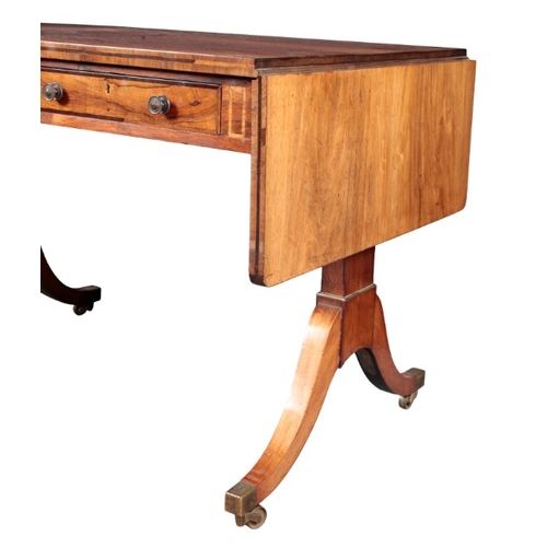 257 - A GEORGE IV ROSEWOOD SOFA TABLE

the rectangular top over two frieze drawers to one side and two fau... 