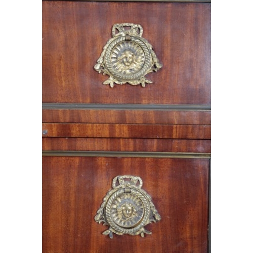 261 - A FRENCH EMPIRE STYLE MAHOGANY TALL CHEST

the six drawers with gilt metal escutcheons and flanked b... 