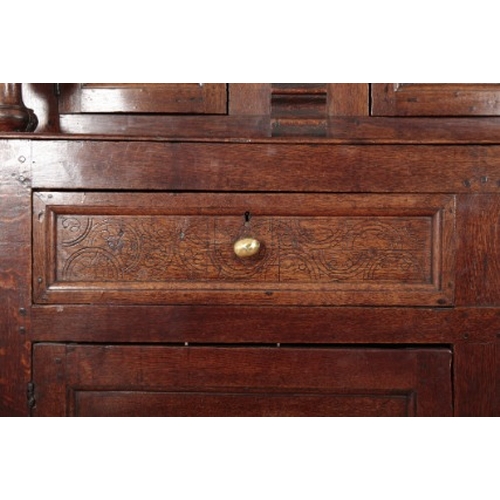 266 - A PANELLED OAK COURT CUPBOARD

17th century, the upper part with turned columns and moulded pilaster... 