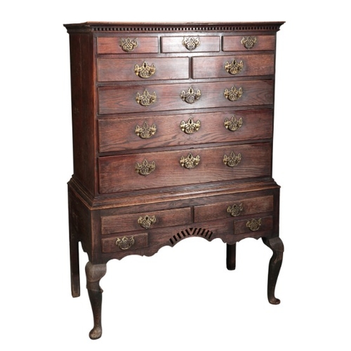 280 - A GEORGE II OAK CHEST ON STAND

mid 18th century, the upper section with a dentil moulded cornice ov... 