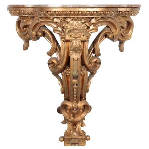 283 - A GILTWOOD AND COMPOSITION WALL BRACKET

the shaped marble top with an egg and dart moulded frieze o... 