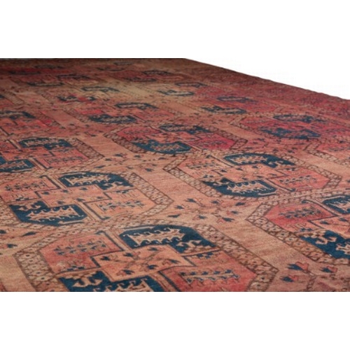 290 - A LARGE ANTIQUE BELUCH CARPET

of Turkoman design, the brick red ground with three rows of elephants... 