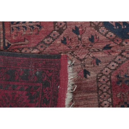 290 - A LARGE ANTIQUE BELUCH CARPET

of Turkoman design, the brick red ground with three rows of elephants... 