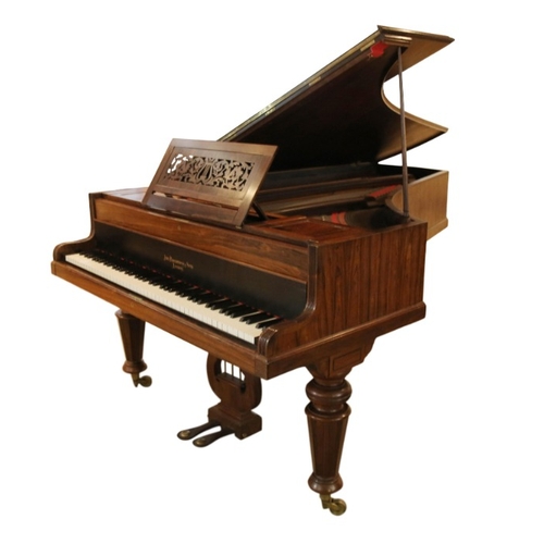 291 - A VICTORIAN ROSEWOOD GRAND PIANO BY JOHN BROADWOOD & SONS

with reeded mouldings, on four panelled a... 